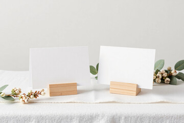 Two blank white table tent cards mockup on neutral background