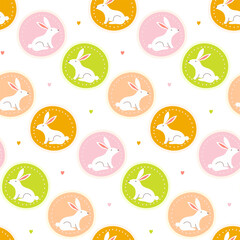 Cute white bunny seamless pattern. Rabbits in colorful medallions with small hearts. Sweet nursery background for baby textile, wallpaper, and Easter gift wrap. Bright flat illustration