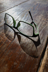 Broken Glasses Casting Shadow in Sunlight