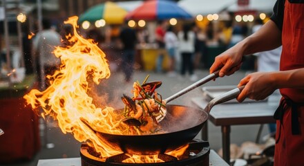 Fototapeta premium Expert chef skillfully stir-fries vibrant fresh seafood and colorful vegetables in a fiery wok at a bustling outdoor street food festival, showcasing culinary energy