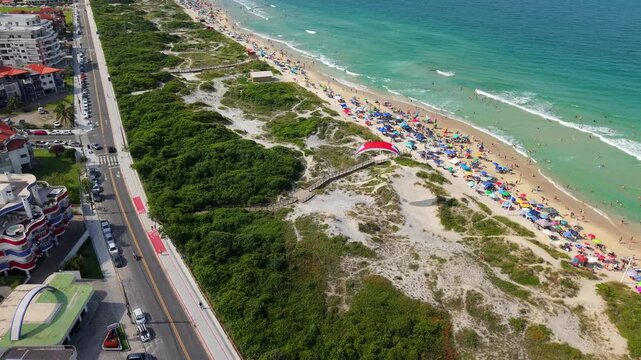 Aerial Drone of Powered Paragliding Over Florianopolis beach Santa Catarina Brazil Tropical Coast