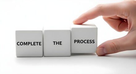 Hand carefully aligning word blocks that spell out complete the process in a staged finishing sequence