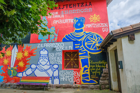 Historical Mural in Amaiur Village Commemorating the Resistance of 1522, Colorful Wall Art With Knight and Basque Text
