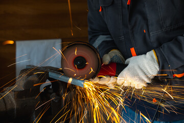 cutting a metal part with an angle grinder