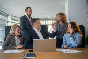 Business colleagues arguing during a tense office meeting with manager
