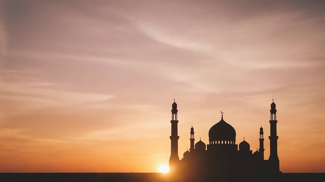 mosque silhouette at sunset over horizon