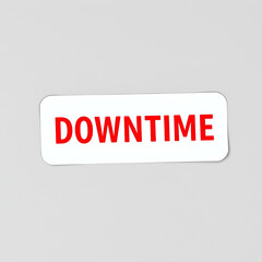 Sticker label with word downtime in red color on gray background