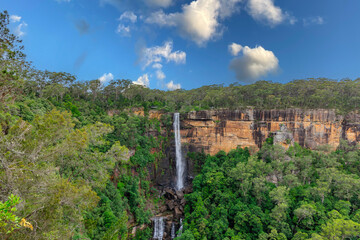 Beautiful flowing River in Fitzroy water Falls in Bowral NSW Australia beautiful colourful cloudy skies lovely waterfalls