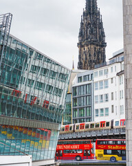 Fototapeta premium 02.02.2021, Hamburg, Germany - city center with all the sights on the shore with a view of train. Contrast between modern and old architecture.