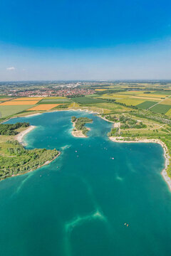 Aerial View of Hollenersee Lake in Munich, Germany on a Sunny Summer Day with Recreational Activities