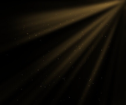 Golden sun rays shining through darkness with floating dust particles. Dramatic light beam effect on black background. Abstract cinematic illumination overlay with warm glow and atmospheric mood.
