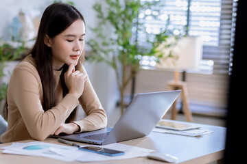 Fototapeta premium Business woman at desk in office for celebration of goals or target. Computer, smile and success with happy employee in workplace for achievement or milestone
