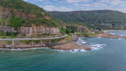 Sea Cliff Bridge on the southern coast of Sydney with sweeping Ocean Views and Mountain terrain. a major Bridge Road on the beautiful Australian coastline Australia