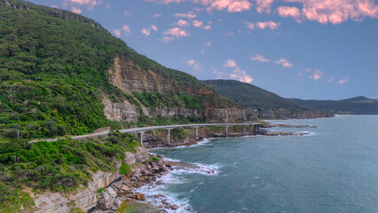 Sea Cliff Bridge on the southern coast of Sydney with sweeping Ocean Views and Mountain terrain. a major Bridge Road on the beautiful Australian coastline  © Elias Bitar