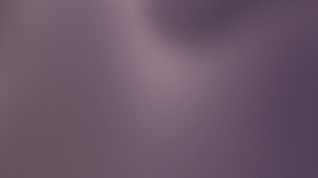 Soft and ethereal gradient background in muted shades of purple and warm mauve, creating a serene and gentle visual texture perfect for versatile design projects, presentations, or digital backdrops