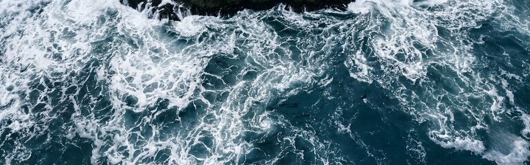 Naklejka premium Aerial View of Powerful Ocean Waves and Rocky Coast