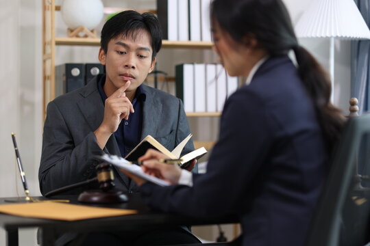 Lawyers discussing legal issues in office.