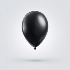 Obraz premium Black balloon floats in the air against a gray background
