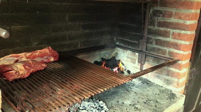 Charcoal Fire and Beef Ribs on Parrilla &ndash; Argentine BBQ Tradition