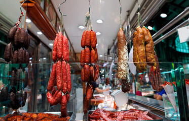 A traditional food market stall with a variety of cured sausages A Taste of Gastronomy