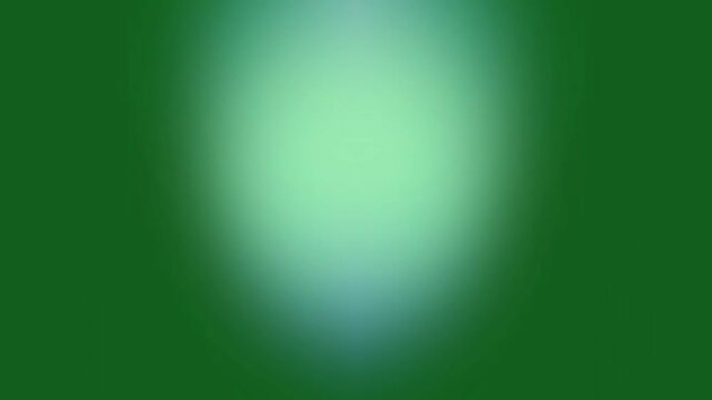 Blurry green oval shape on dark green background, viewed from directly above, depicting a soft, abstract illustration