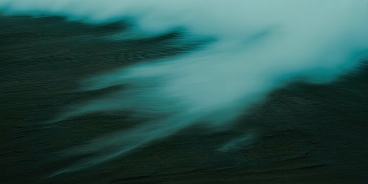 A dark and mysterious landscape with a glowing blue mist