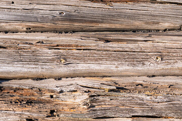A detailed view of weathered wooden logs beautifully showcasing their rustic textures and captivating natural beauty