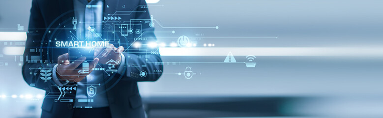 Home owner using mobile smart phone with Smart Home applications for global networking, controlling...