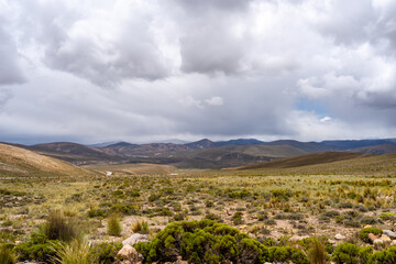 Fototapeta premium Vast valley and mountains landscape with dramatic sky, Peru