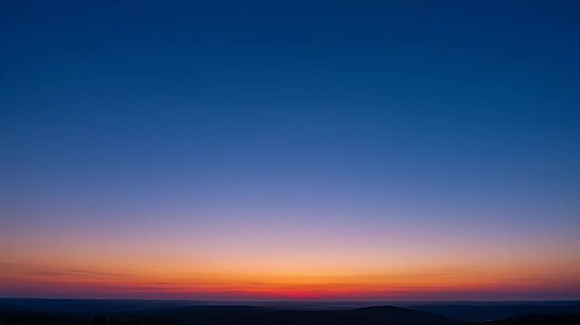 Vibrant Sunset Fading Over Rolling Hills