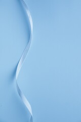 Blue ribbon on a blue background. Background for a card.