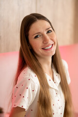 Pretty young woman feeling good and smiling nicely