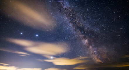 a night sky with a milky and a few stars