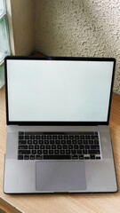 Modern Space Gray MacBook Pro Mockup on Minimalist Wooden Desk with Blank Screen