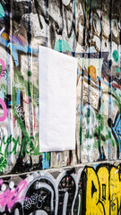 Blank White Paper Urban Poster Mockup on Street Graffiti Wall Background Outdoor