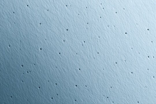 Pastel blue textured paper background with punched perforation details, luxury minimalist design