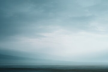 Fototapeta premium Expansive minimalist landscape with soft horizon line, muted tones, calm atmosphere, large copy space, fine art photography