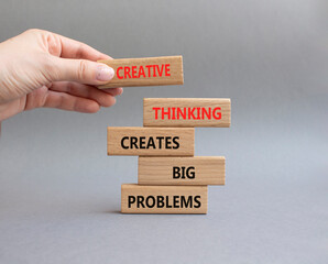 Creative Thinking symbol. Wooden blocks with words Creative Thinking Solves Big Problems. Businessman hand. Beautiful grey background. Businessman hand. Business concept. Copy space
