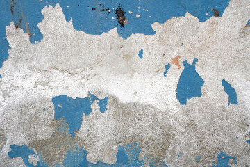 Fototapeta premium Peeling blue paint on textured concrete wall background
