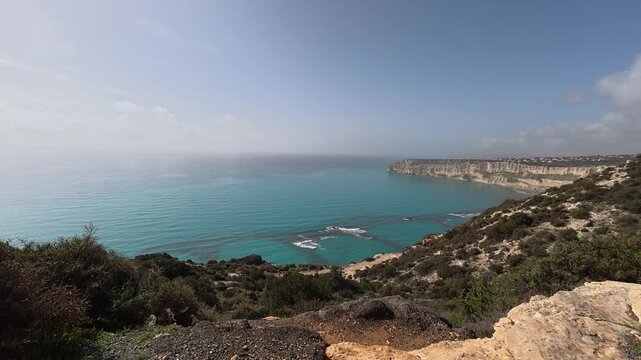 4K wide angle aerial view of Kourion Beach and coastline in Limassol, Cyprus.