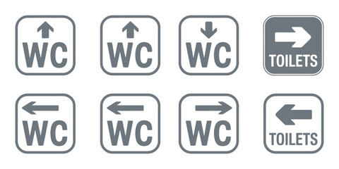 Collection of directional bathroom and toilet signs with various arrows