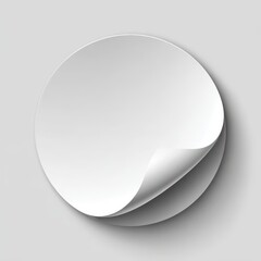 Realistic White Round Sticker with Curled Edge and Soft Shadow on Grey Background.