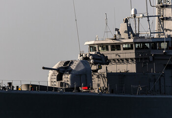 Navy frigate sail on the smooth sea during mission of protect and rescue in sea. © ValStock