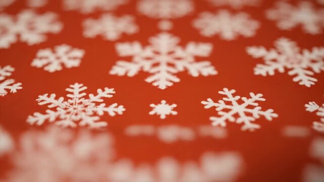 Close up of decorative snowflakes against a vibrant red background