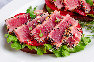 Breakfast, sandwiches, fried tuna fillet, in sesame seeds, no people, top view, homemade, © DideBashvili