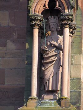 Telephoto close-ups of sculptural details of Freiburger M&uuml;nster cathedral, including Gothic saints, prophets, gargoyles, ornamental figures and waterspouts carved in red , DE, Mart 2011