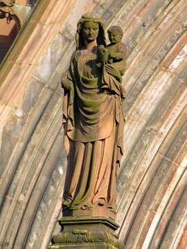 Telephoto close-ups of sculptural details of Freiburger M&uuml;nster cathedral, including Gothic saints, prophets, gargoyles, ornamental figures and waterspouts carved in red , DE, Mart 2011