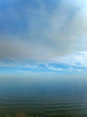 Serene Seascape View with Calm Waters and Cloudscape, Capturing Tranquility and Vastness of Ocean and Sky, Horizon Line