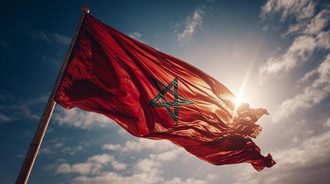 moroccan flag waving in blue sky. flag of morocco