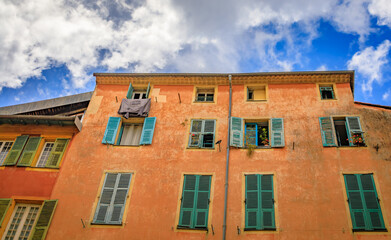Fototapeta premium Mediterranean houses in terracotta colors with traditional shutters, Nice France